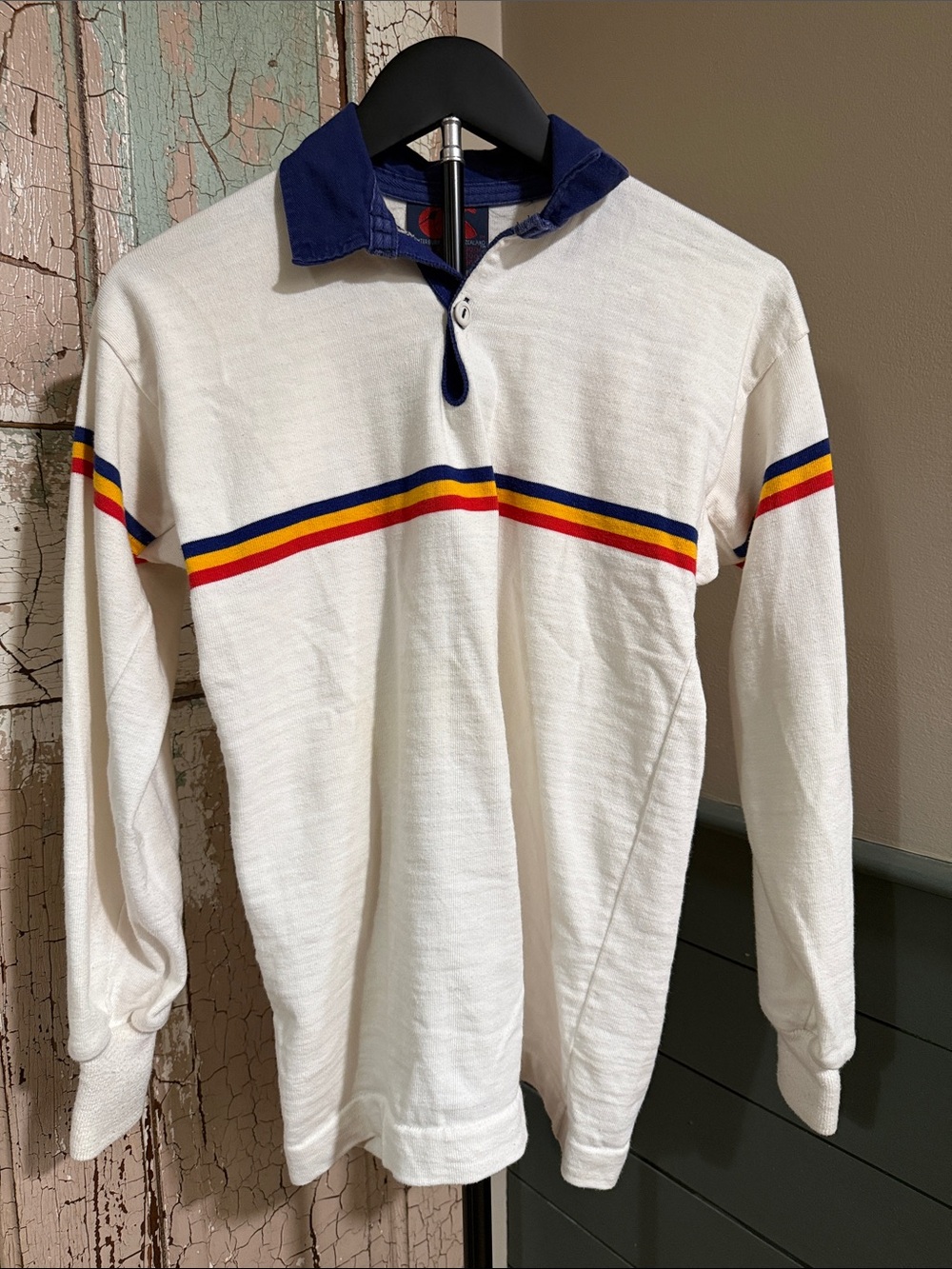White Long-Sleeve Polo Sweater with Navy Collar and Multicolor Chest Stripe